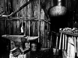 Old iron anvil in a rough wooden barn. Photo by Gabino Iglesias.