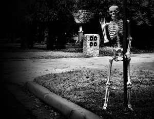 Skeleton hanging on a street sign. Photo credit: Gabino Iglesias,
